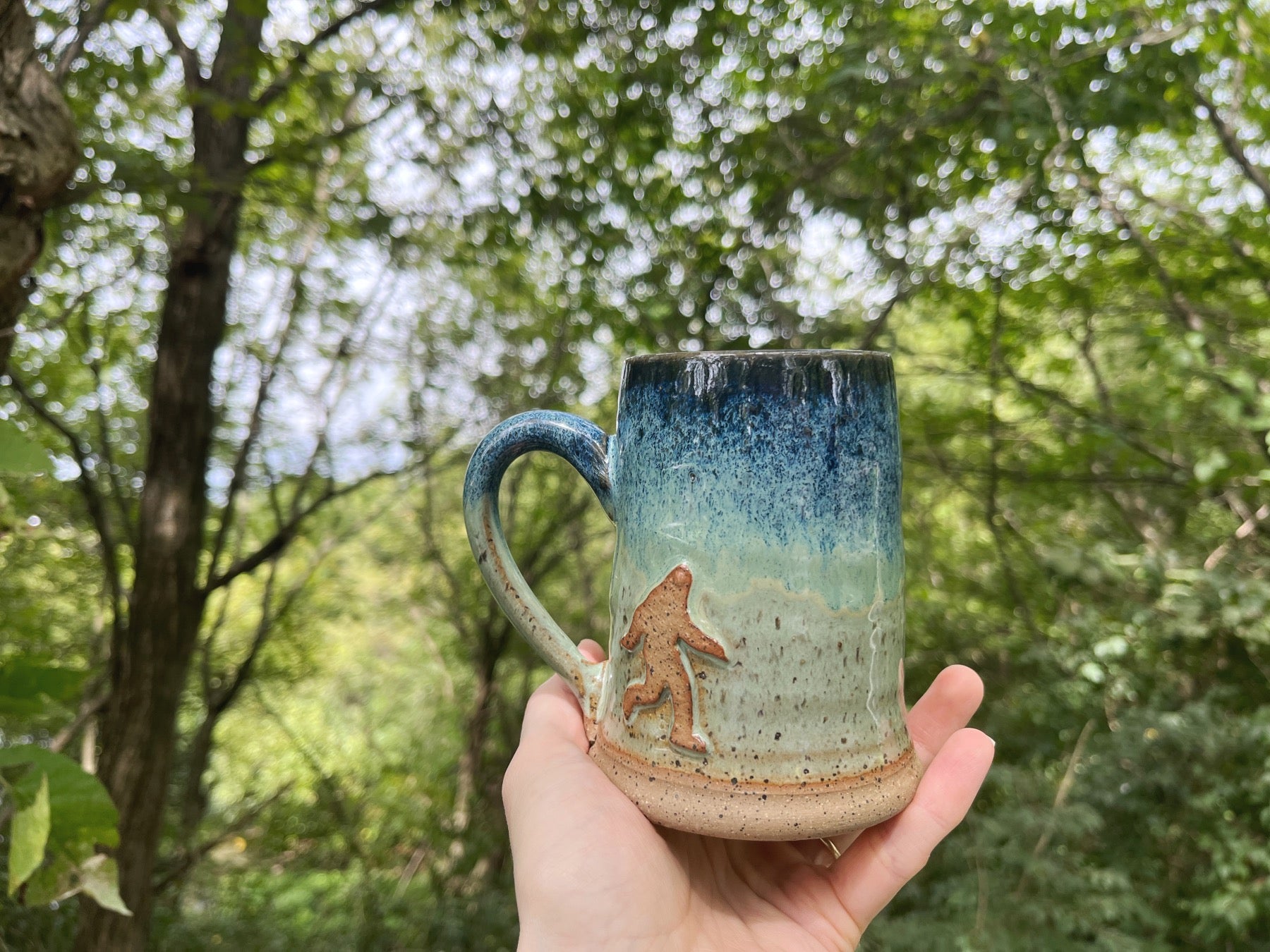 https://www.dirtysouthpottery.com/cdn/shop/products/BigfootMugWoods1.jpg?v=1675883305